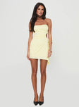 back view of model wearing Princess Polly Twyla Strapless Mini Dress Yellow Asymmetric Neckline 