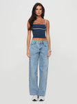 side view of model wearing Princess Polly Serenitia Mid Rise Relaxed Jeans Light Wash Tall Mid Rise 