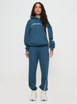 front view of model wearing Princess Polly Princess Polly Track Pants Block / Cursive Text Slate Mid Rise 