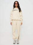 front view of model wearing Princess Polly Princess Polly Track Pants Block / Cursive Text Stone Mid Rise 