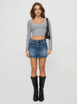   front view of model wearing Princess Polly Arrte Mid Rise Denim Mini Skirt Mid Wash Petite Mini Skirts 