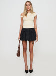   side view of model wearing Princess Polly Vannes Bubble Hem Mini Skirt Black Mini Skirts 