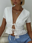 front view of model wearing Princess Polly Davist Top White Short Sleeves Plunger 