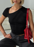 front view of model wearing Princess Polly Stela Top Black Sleeveless Asymmetric Neckline 