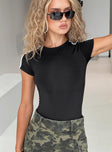 front view of model wearing Princess Polly Edensi Bodysuit Black Short Sleeves Crew Neck 