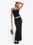   side view of model wearing Princess Polly Kalyn Ruched Front Maxi Skirt Black Maxi 