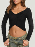 Long sleeve top Shirred material, v-neckline, inverted v-hemline Good stretch, unlined 