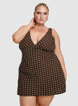 side view of model wearing Princess Polly Nellie Mini Dress Brown Polka Dot Curve Plunger 