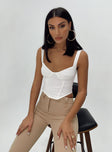 Front view of model wearing  front Princess Polly Sleeveless Square Neck  Bruna Top White