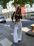 Front view of model wearing  front Princess Polly High Waisted  Eivissa Baggy Jeans Pearl