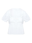 side view of model wearing Princess Polly Elizabette Puff Sleeve Top White Short Sleeves Scoop Neck 