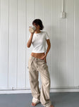 Front view of model wearing  front Princess Polly High Waisted  Miami Vice Pants Beige