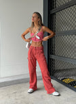 side view of model wearing Princess Polly Miami Vice Pants Red Mid Rise 