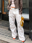 Front view of model wearing  front Princess Polly Low Rise Pants  Miami Vice Swish Pant Ghost White