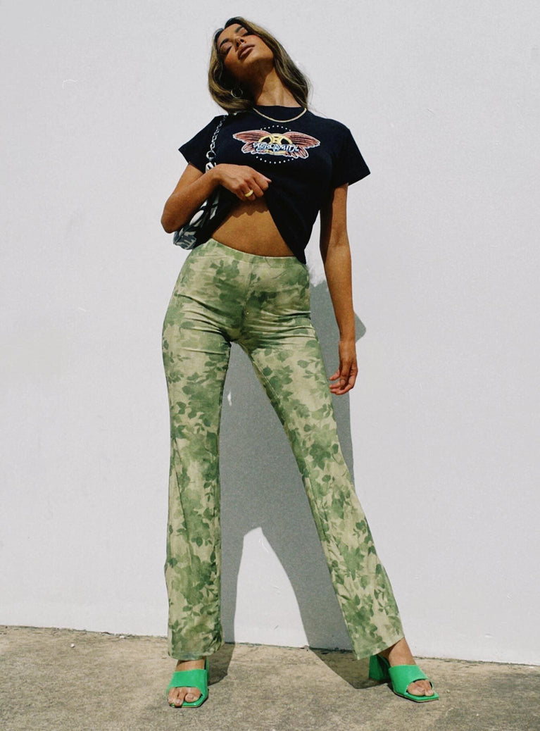 front view of model wearing Princess Polly Motel Heny Trouser Blurred Floral Green 