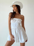 Strapless romper Lace details Ruffle neckline  Adjustable tie at neckline  Shirred back  Twin hip pockets 