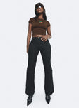 Black pants Low rise Belt looped waist Twin hip pockets Slim leg  Slightly flared cuff