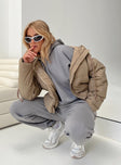 Beige puffer jacket Hood with drawstring Zip front fastening Twin front pockets Elasticated cuffs Drawstring waist