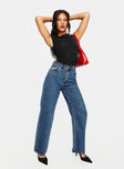 High rise jean, mid-wash denim Relaxed leg, five pocket designs, belt looped waist, button & zip front fastening 