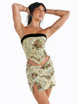 Mini skirt Tapestry print  V waist Slit at hem Good stretch Unlined 