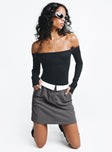 Mini skirt Folded waist detail Zip and clasp fastening Twin hip pockets