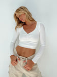 White long sleeve top V neckline Pinched detail at bust Good stretch Mesh lined front