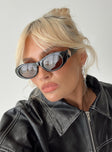 Sunglasses Oval-shaped lenses, brown-tinted lenses, black frames, brass-tone hardware detail