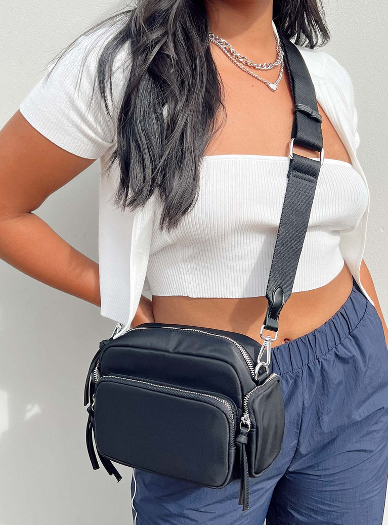 Crossbody bag Nylon material Silver-toned hardware Zip fastening Front & side pocket detailing Adjustable & removable crossbody strap Inner pocket zip fastening Flat base with feet studs