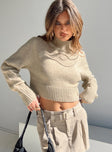 Cropped sweater  97% recycled fibers 3% elastane  Soft knit material  Mock neck  Good stretch  Unlined 