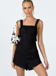 Black romper playsuit Linen look material  Elasticated halter neck tie fastening  Straight neckline  Frill trim  Low back 