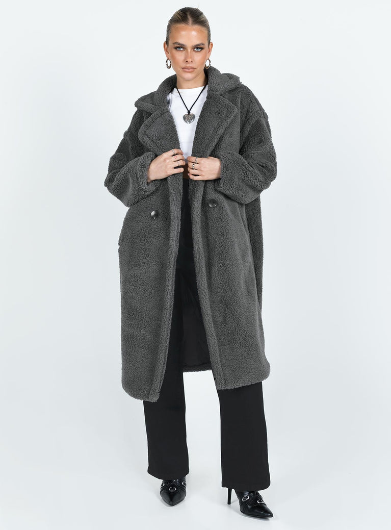 Coat Collared neckline Front button fastening Twin side pockets