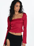 Long sleeve top Silky material Square neckline Open back with tie and button fastenings Slightly flared cuff