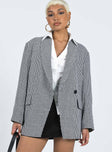 Jacket Houndstooth print Lapel collar Button fastening Twin faux hip pockets Two button cuff