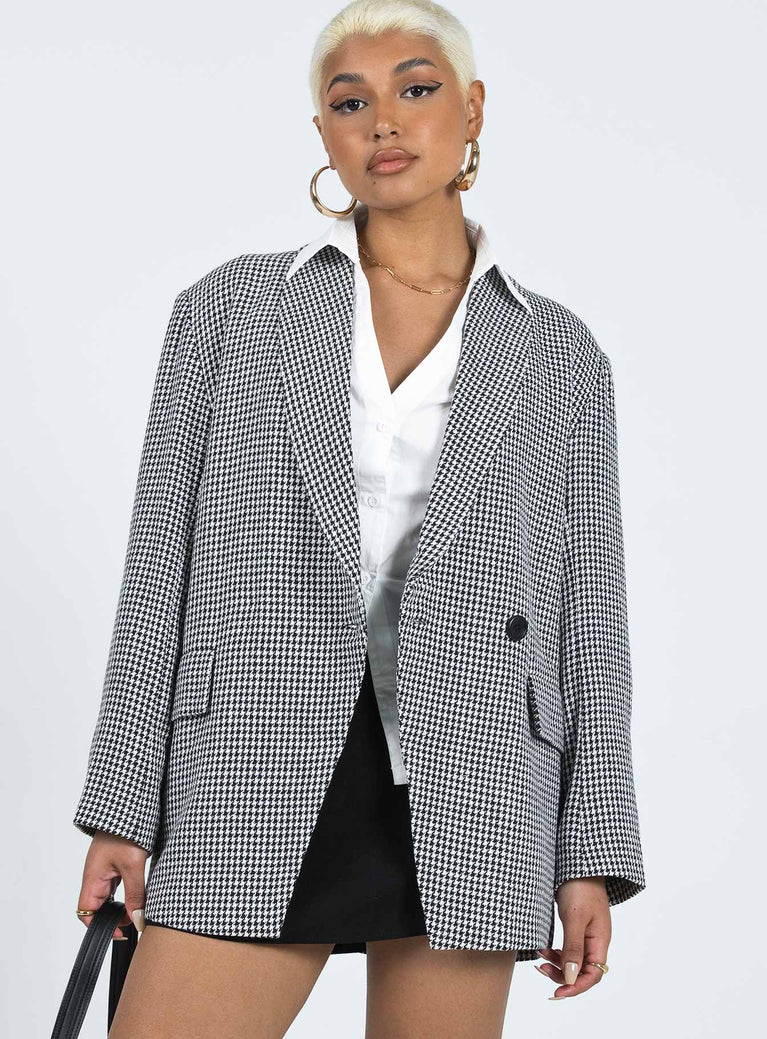 Jacket Houndstooth print Lapel collar Button fastening Twin faux hip pockets Two button cuff