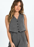 Vest top Pinstripe print V neckline Button fastening at front Faux pockets Pointed hem