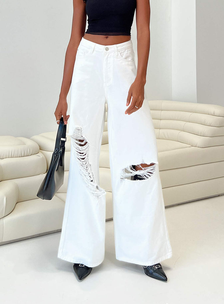 Jeans White denim High rise Belt looped waist Zip and button fastening Classic five pocket design Branded patch a back Wide leg Ripped knees