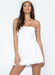 Strapless romper Lace details Ruffle neckline  Adjustable tie at neckline  Shirred back  Twin hip pockets 