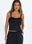 Black crop top Silky material Adjustable shoulder straps Scooped neckline Non stretch Lined bust