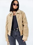 Aviator jacket Faux fur material  Large collar  Bucket fastening at neckline Zip front fastening  Twin hip pockets  Buckles at hem 