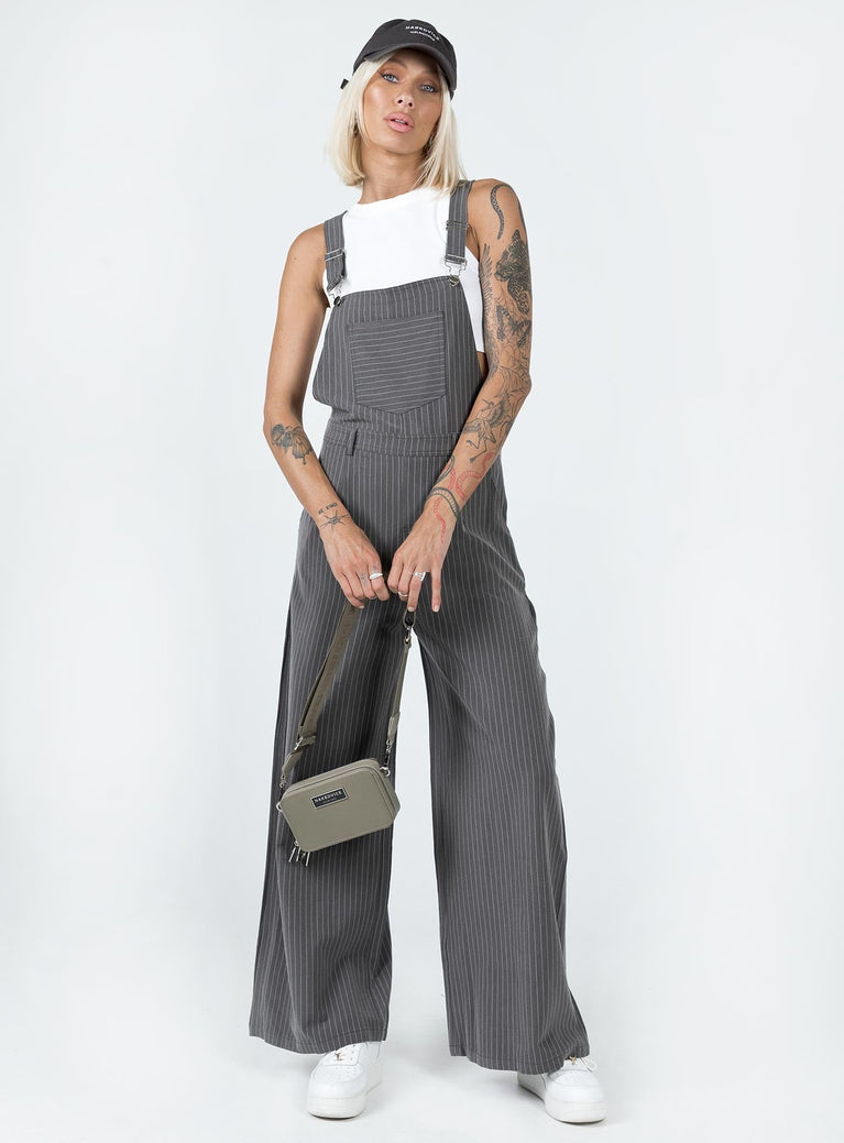 Overalls Pinstripe print  Adjustable shoulder straps  Chest pocket  Belt looped waist  Invisible zip fastening at side  Four-pocket design  Wide leg 