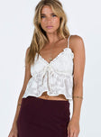 Crop top Sheer material Adjustable shoulder straps V neckline Tie detail at bust Frill trim