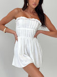 Strapless romper Frill neckline, shirred band at back, invisible zip fastening at side, ruched waist Non-stretch material, partially lined