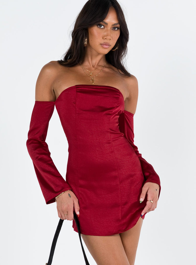 Red mini dress Silky material Off the shoulder design Inner silicone strip at bust Invisible zip fastening at back Fixed sleeves at side