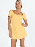 Yellow mini dress Square neckline Inner silicone stripe at bust and shoulders Invisible zip fastening at back 