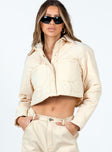 Cropped cream puffer jacket Quilted material Classic collar Press button fastening at front Twin chest pockets