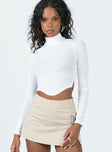 Long sleeve top Semi-sheer material  Mock neck  Rounded hem 