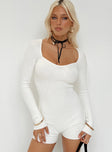 White long sleeve romper Ribbed knit material Sweetheart neckline Good stretch