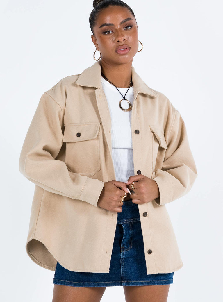 Beige jacket Soft material Pointed collar Button fastening at front Twin chest pockets Single button cuff