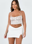 Mini skirt Crochet knit material Mid-rise V-waist Invisible zip fastening at side Slight stretch 