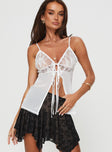 Lace top Adjustable shoulder straps, v-neckline, twin tie fastening at bust, split hem Non-stretch material, unlined, sheer